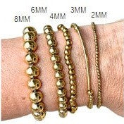 Layered Luxuries Gold Beaded Bracelets